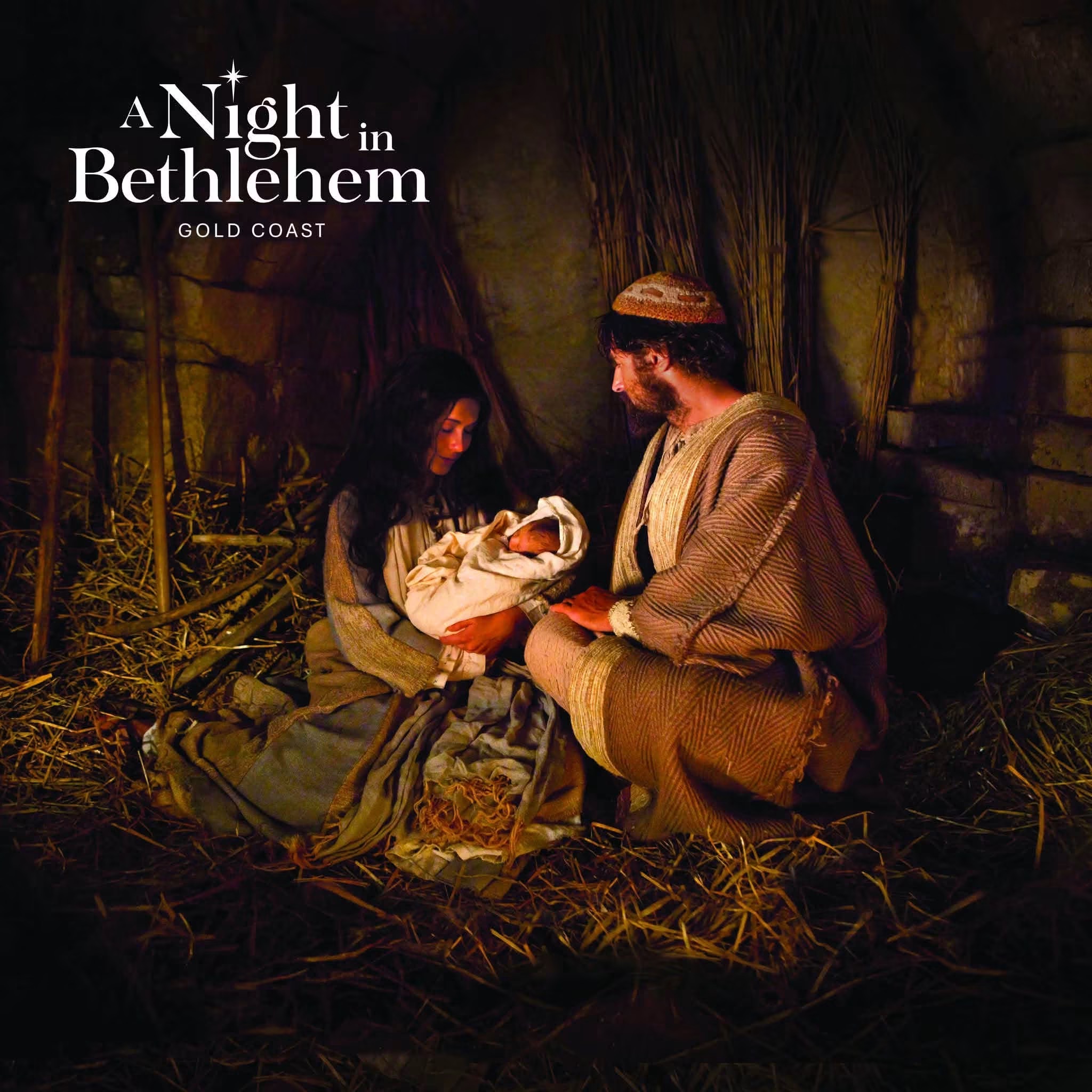 Mary and Joseph kneeling beside the newborn Jesus in the lamplit stable